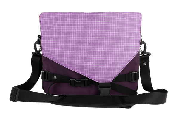 The Maker's Bag in Aubergine (dark purple) Ballistic with a Wisteria (light purple with white grid) 200 Halcyon interior.